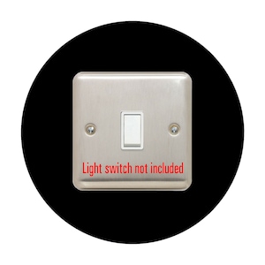 May include: A silver light switch plate with a single light switch and the text "Light switch not included" printed below the switch.