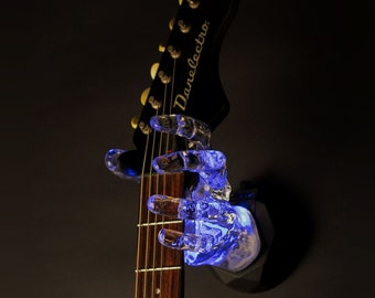 Illuminati - Colgador de instrumentos de guitarra de mano transparente con luz LED de GuitarGrip - Agarre izquierdo