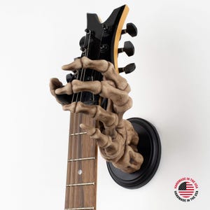 Griff Reaper Skelett Hand Wandhalterung zum Aufhängen von Akkustik- und E-Gitarren und anderen Saiteninstrumenten - Linker Griff