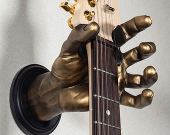 Percha de pared para guitarra con forma de mano Gold GuitarGrip (agarre izquierdo)