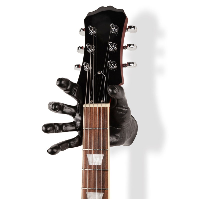 Percha de guitarra derecha negra Mano masculina imagen 1