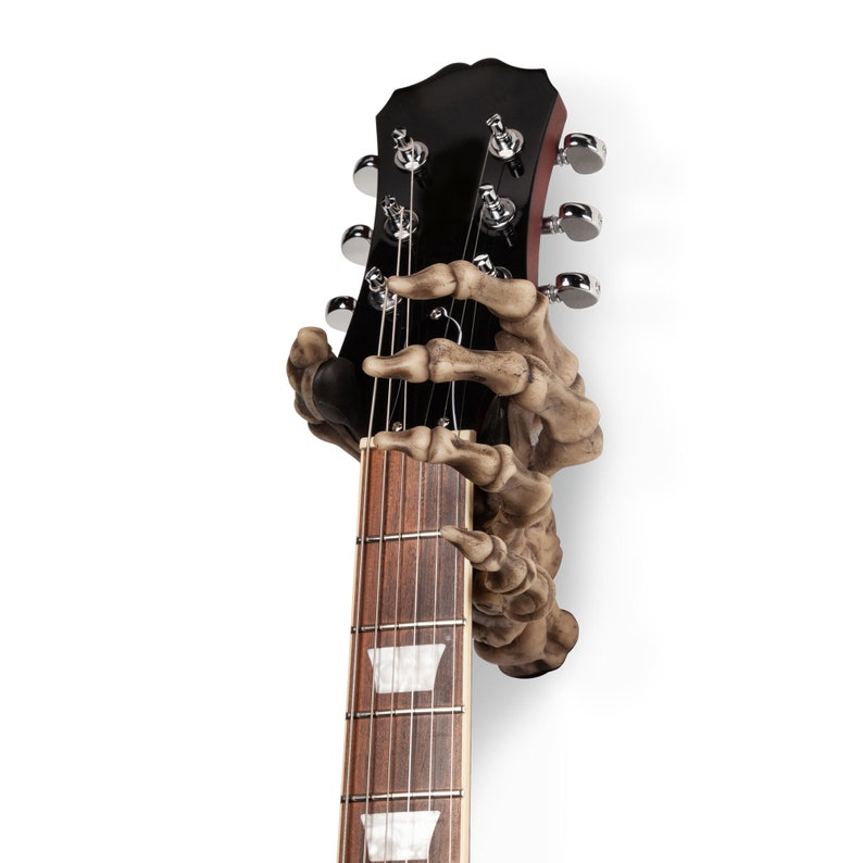 Skeleton Hand electric and acoustic guitar wall hook for storing your instrument on the wall.