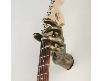 Colgador de guitarra montado en la pared con forma de mano Gold GuitarGrip - Agarre izquierdo