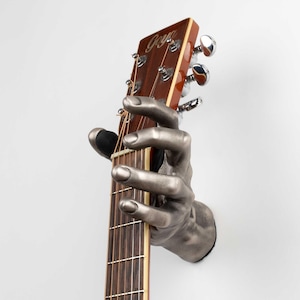 Supporto per chitarra da parete a forma di mano Silver GuitarGrip - impugnatura sinistra