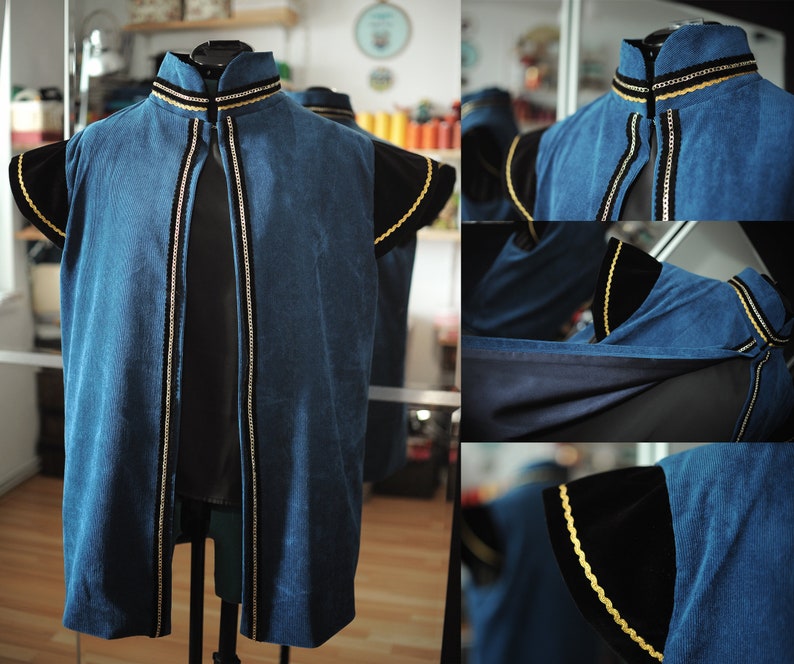 May include: A blue corduroy vest with black velvet sleeves and gold trim. The vest has a high collar and a front opening. The sleeves are short and flared. The gold trim is along the collar, front opening, and sleeve edges.