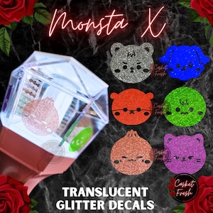 May include: A light stick with a hexagonal clear top and a rose-gold base, featuring a rose-gold glitter decal of a character. Beside it are six glitter decals in silver, blue, orange, green, rose-gold, and purple, all with character faces.