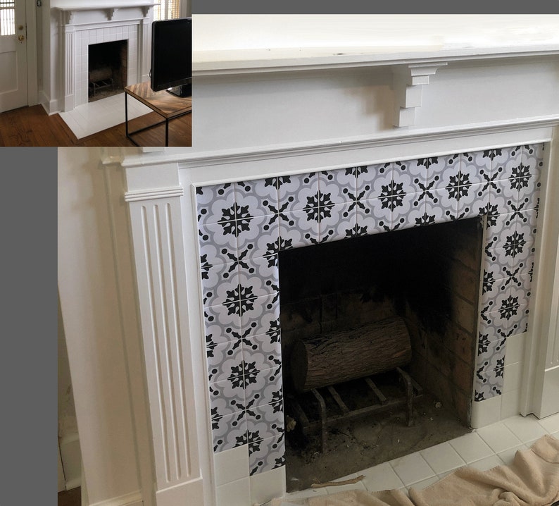May include: A white fireplace with a black and grey patterned tile surround. The fireplace opening is dark, with a metal grate and a log inside. The mantel is white.