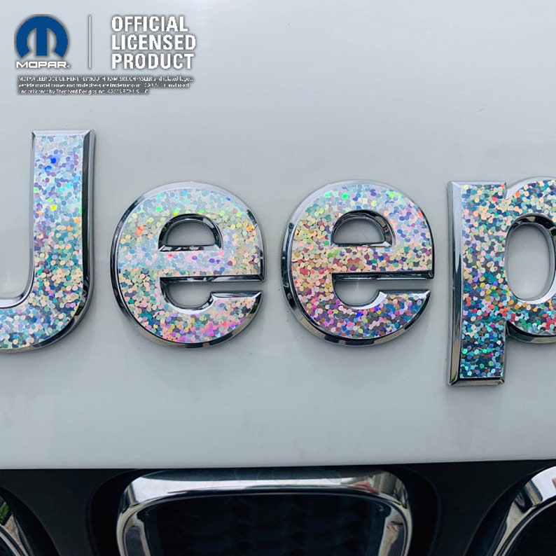 A holographic silver sequin decal (sticker) on a Jeep cherokee