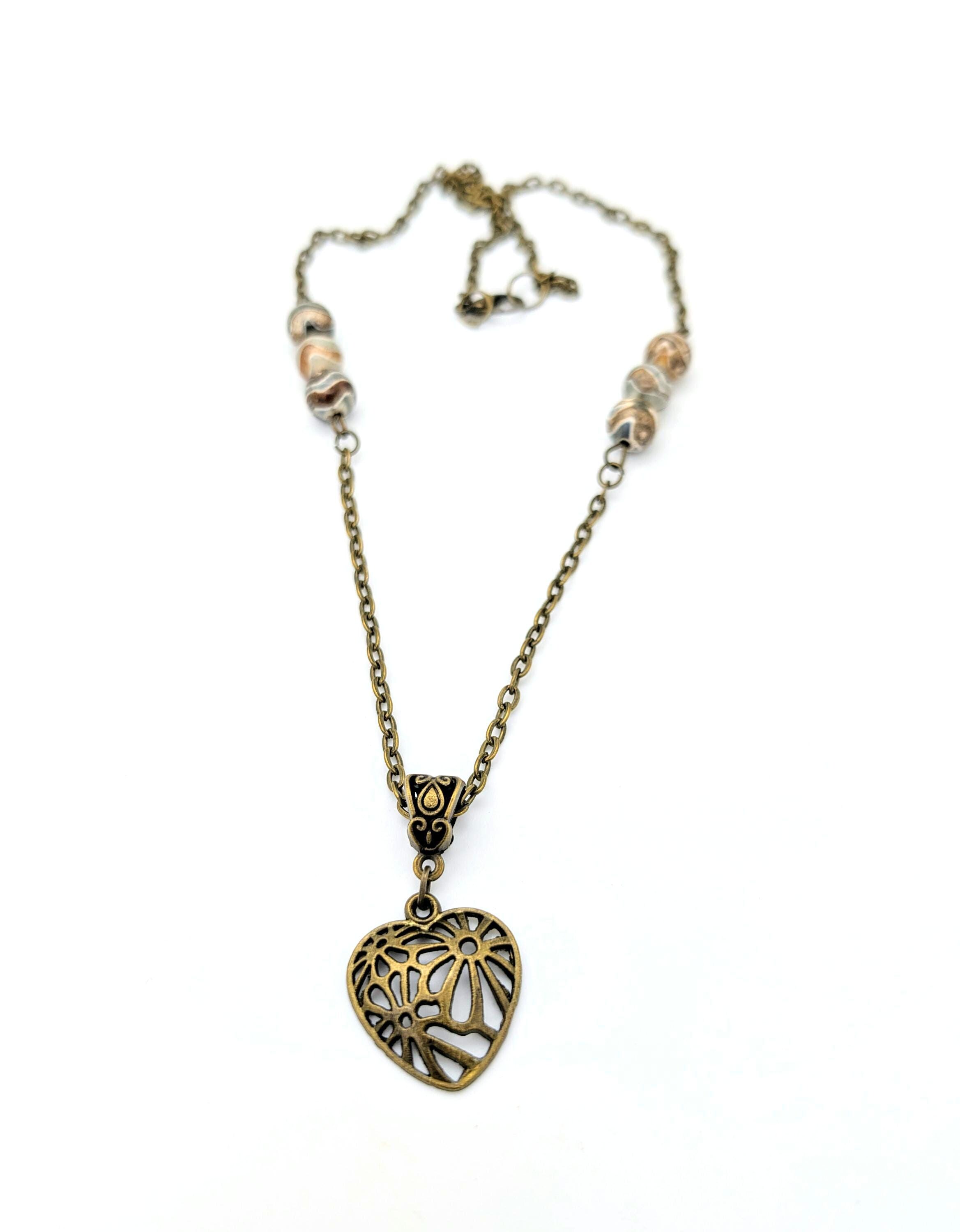 Médiéval Bronze Pendentif broche en forme de coeur avec - Catawiki