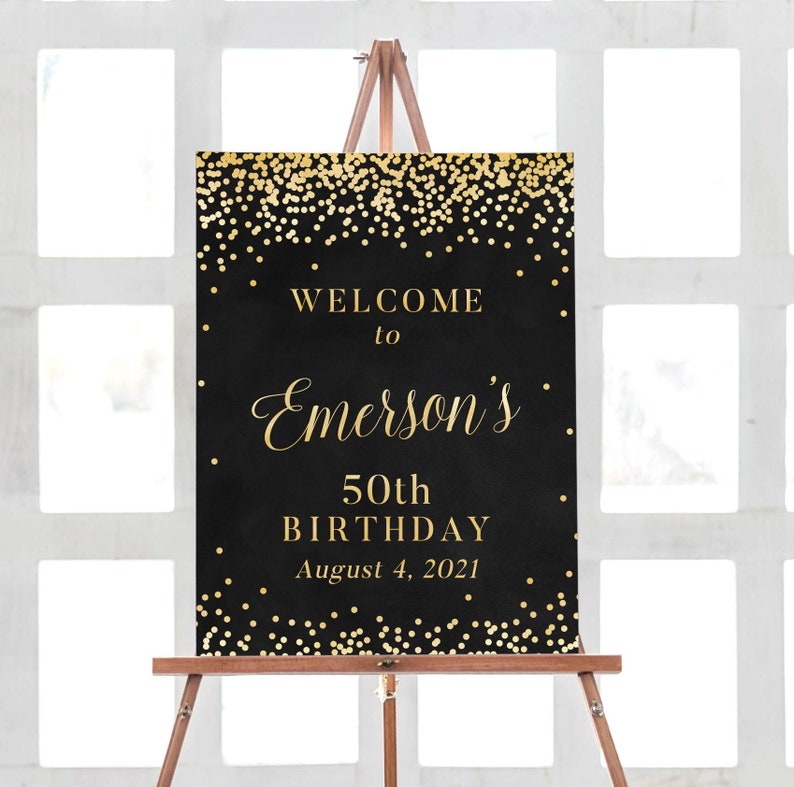 May include: Black and gold welcome sign with gold confetti. The sign reads "Welcome to Emerson's 50th Birthday August 4, 2021".