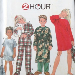 May include: Simplicity sewing pattern 7407 for children's sleepwear. The pattern features pajama sets, a robe, and a nightgown. The package shows illustrations of children wearing the sleepwear. The size range is AA 3, 4, 5, and 6.
