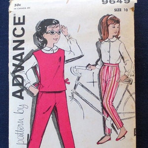 May include: Vintage sewing pattern envelope featuring illustrations of a woman in a red outfit and another in striped pants. The envelope is labeled "ADVANCE" and includes the size "10". The background is a dark blue.