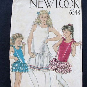 May include: Vintage New Look 6348 sewing pattern featuring illustrations of three young girls in dresses. The pattern cover is off-white with the brand name and pattern number printed in black.