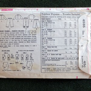 May include: Vintage Simplicity pattern for toddler pajamas, size 1. The pattern includes instructions for three pajama styles with long or short sleeves, and elastic waistbands. The envelope is cream-colored with black text and illustrations.