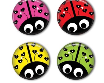 May include: Four circular pin-back buttons featuring a ladybug design. Each button has a black head with two large white eyes and a colorful body in pink, red, yellow, or green. The bodies are decorated with black heart-shaped spots.