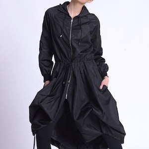 Black Asymmetric Hooded Raincoat by METAMORPHOZA