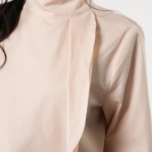 Women Asymmetrical Turtleneck Shirt with Pocket image 9