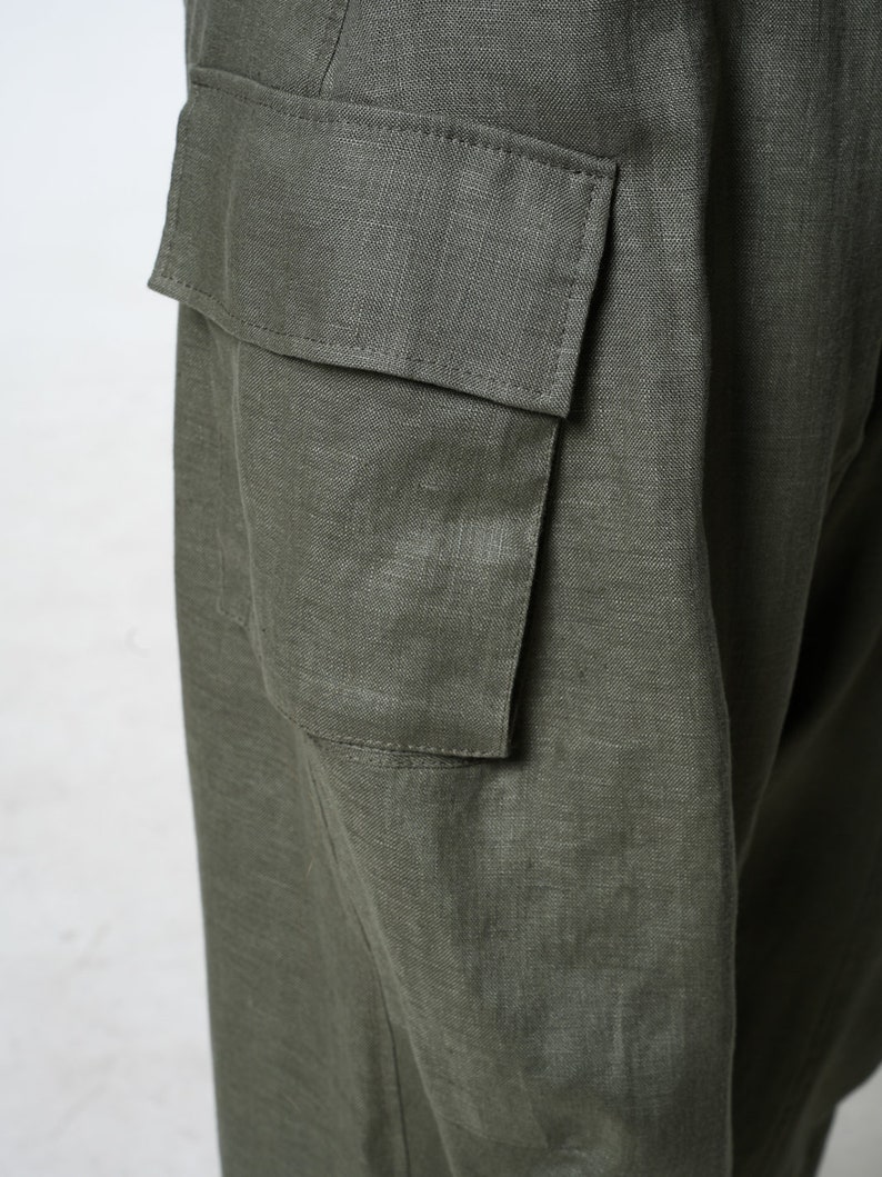 May include: A pair of green linen cargo pants with a large cargo pocket on the side.