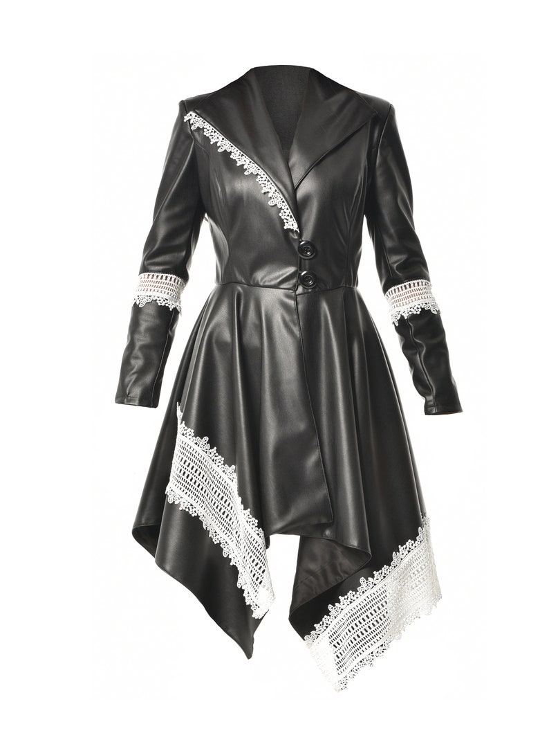 May include: A black faux leather jacket with a white lace trim. The jacket has a long, asymmetrical hemline and a collar.