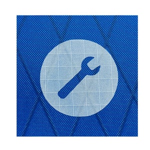 May include: A white circle with a blue background containing a white wrench icon on a blue textured background.
