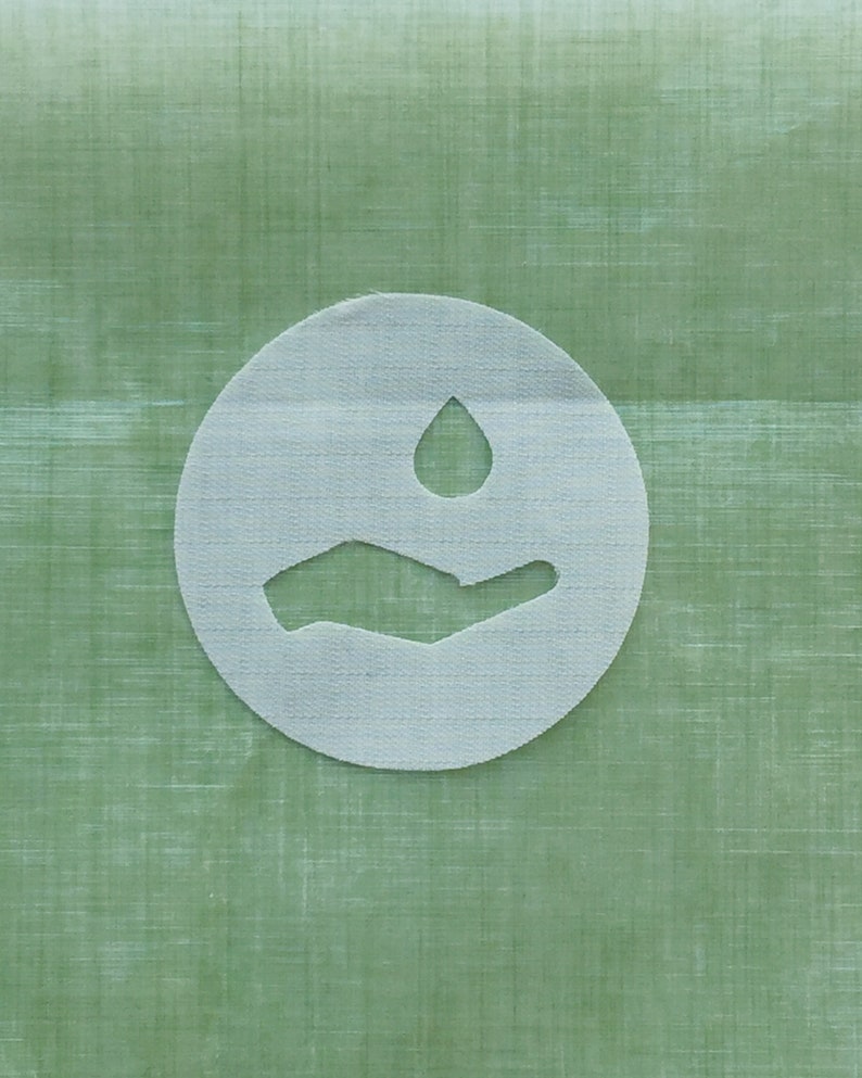 May include: A white circle with a hand holding a water drop on a green background.