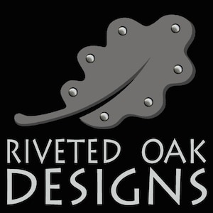 May include: A gray oak leaf with silver rivets, the text "Riveted Oak Designs" is below the leaf.