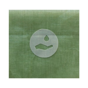 May include: A green fabric with a white circle containing a hand with a water drop above it. The fabric has a subtle texture.