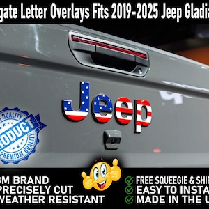 May include: Tailgate letter overlays for a Jeep Gladiator, featuring the word "Jeep" in red, white, and blue with a stars and stripes design. The overlays are made with 3M brand material and are precisely cut for a perfect fit. They are weather resistant and easy to install.