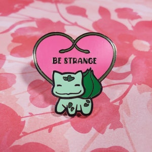 Be Strange PokePositivity Hard Enamel Pin
