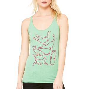 May include: A green tank top with a red outline of five cats in different poses. The cats are stacked on top of each other.