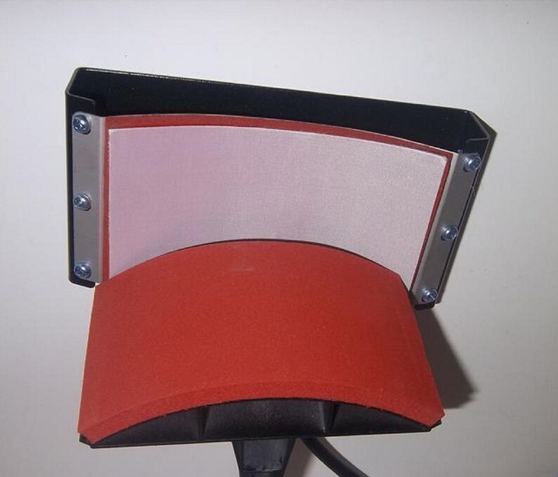 May include: A black heat press with a red and white heat plate. The heat plate is curved to fit a mug or other round object.
