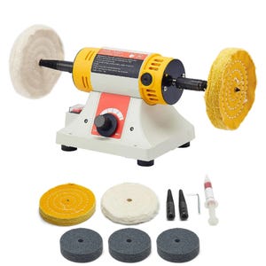 May include: A bench grinder with a yellow and white body, featuring a variable speed dial and two buffing wheels. Additional buffing pads and accessories are included, such as a syringe and various polishing wheels. The machine is designed for polishing and grinding.
