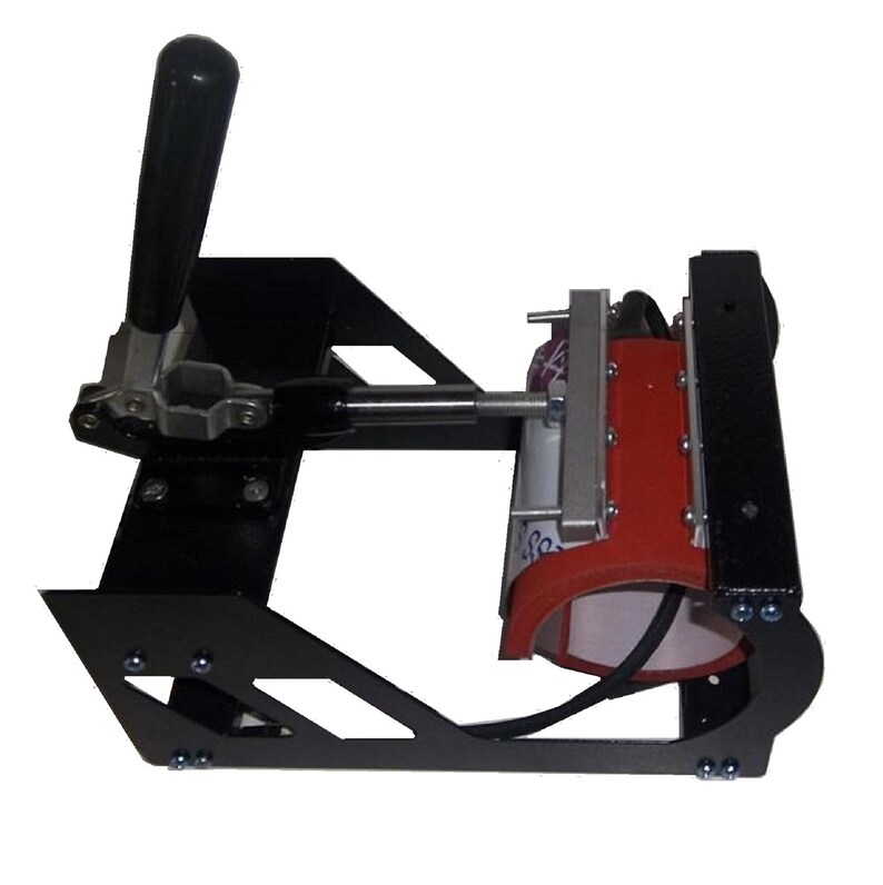 May include: A black mug press with a red heating element and a lever to clamp the mug in place. The mug press is designed to transfer images onto mugs.
