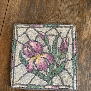 Hand Hooked Spring Iris Mat. Measures 9” x 8.5”.