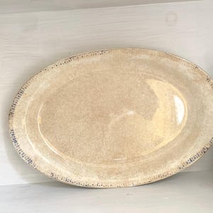Vintage Homer Laughlin Ironstone Platter with Blue Edge.  Measures 15.5” x 10”.