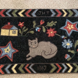 Hand Hooked Rug.  Copy of an antique rug.  Measures 45” x 28”.
