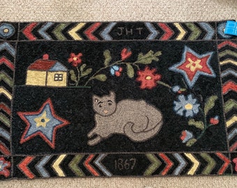 Alfombra tejida a mano. Copia de una alfombra antigua. Medidas: 114 x 71 cm.