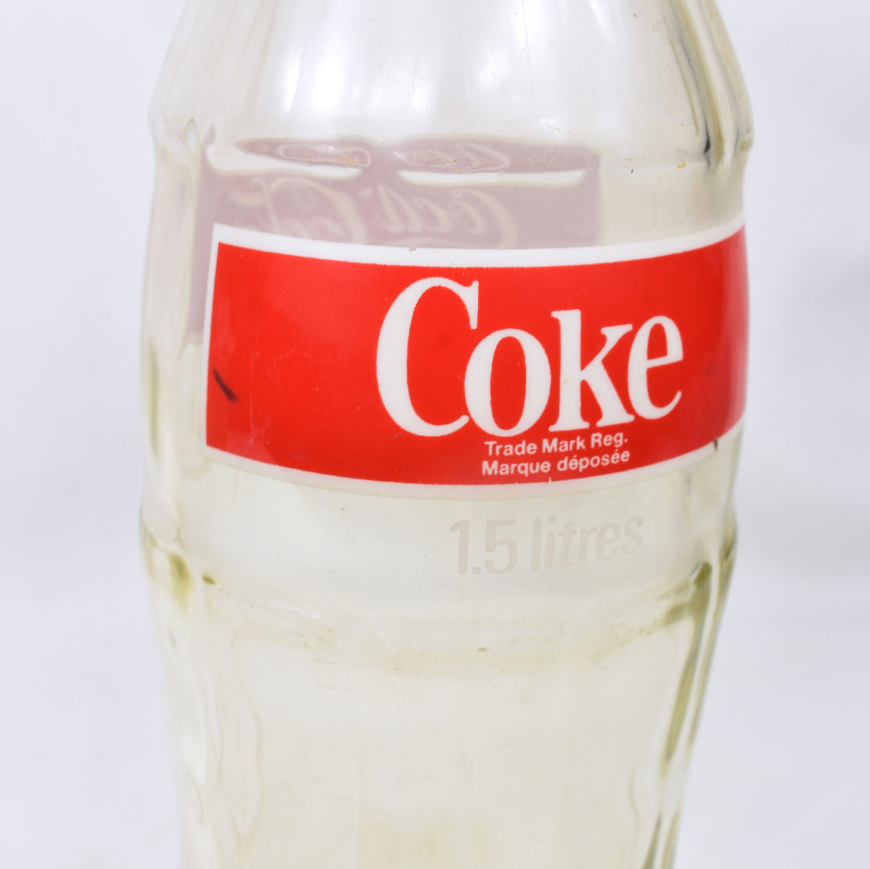 Botela de Coca Cola de 1'5 litros de cristal.
