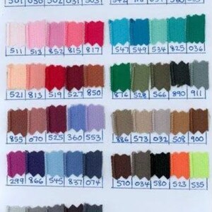 May include: A color chart with 10 rows of 10 fabric swatches. Each swatch is labeled with a number. The colors range from white to black, with many shades of red, blue, green, and brown.