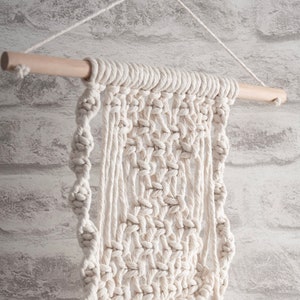 Dowels for Macramé and other crafts by Trimits. In sizes of 12mm or 15mm diameter and 20cm, 30cm, and 50cm lengths. Wood or White