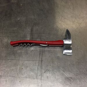 May include: A red and silver multi-tool with a corkscrew, bottle opener, and a small axe.