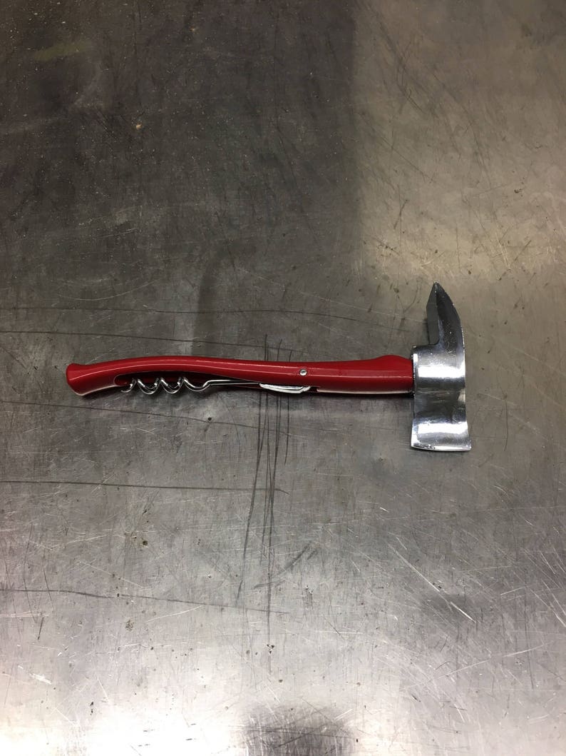 May include: A red and silver multi-tool with a corkscrew, bottle opener, and a small axe.