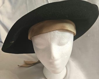 Vintage Mid-Century Woman's Merimac Brand hat, 22" Black Wool Felt, Beige ribbon extended sweat band, headband, bow and tails. Ships free.