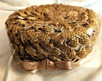 Vintage 1950s Pillbox hat, Brown Straw covered with net, grosgrain bow and interior band, excellent condition, approx. 24 1/2", ships free.
