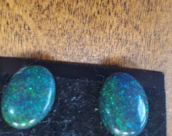 Genuine Australian Opal earrings, Oval shape, surgical steel posts, great colors.