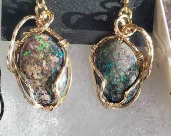 Earrings: Australian Opals from the Andamooka area.  Primarily Green, but with multiple colors.  14 Kt Gold wire wrapped  shipped free.