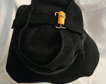 Vintage Mid-Century Woman's Black Wool  Felt Hat in excellent condition, size 22 , black ribbon, side bow & orange buckle trim. Ships free.