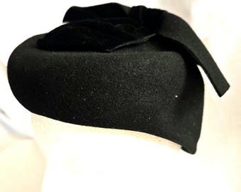 Vintage Mid-Century Black Wool Felt hat with large wool felt and velvet Bow, almost a beret style. Excellent condition. Ships ground free.