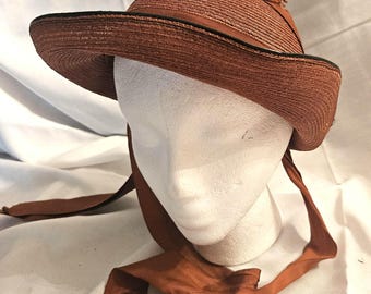 Vintage  Woman's Copper Color Straw Sun Hat with Rust Color Ribbon Trim and Head Band. 21", Excellent Condition. Ships USPS Ground free.