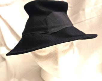 Vintage Mid-Century Black Wool Felt Slouch Hat with a wide ribbon hat band and bow in the back. Excellebt condition. Ships ground free.